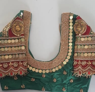 a green blouse with gold coins and coins on it