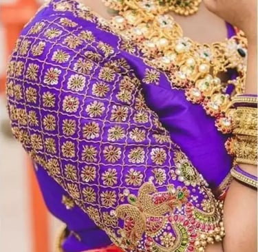 a woman in a purple blouse and gold jewelry