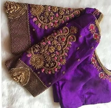 a purple blouse with a gold and purple embroidered blouse