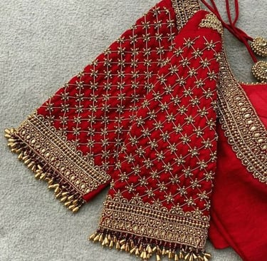 aari work red blouse with hand full of design