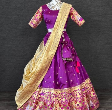 a purple and gold colored silk and gold threadwork work lehenga