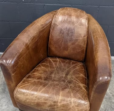 vintage leather armchair with a worn and distressed finish