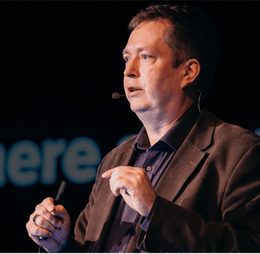 A picture of Esko Reinikainen giving and AI Keynote presentation in Slovakia