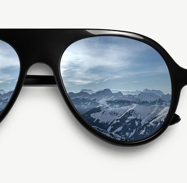 a pair of sunglasses with a mountain view of a mountain range