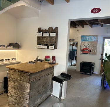 a kitchen with a bar stool and a bar stool