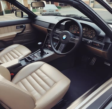 A collection of high-quality car accessories displayed on a wooden table.