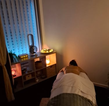 a person laying on a bed in a room