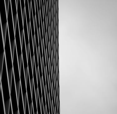Modern architectural detail featuring a geometric mesh screen.