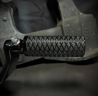 black motorcycle peg with deep knurling and diamond pattern