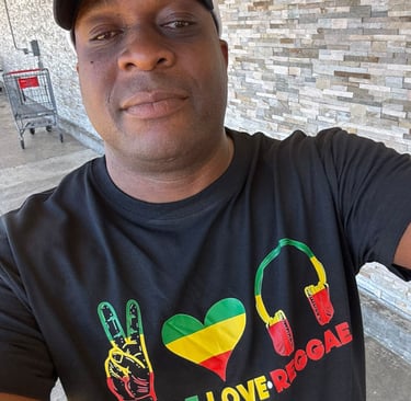 a man in a black shirt and a hat