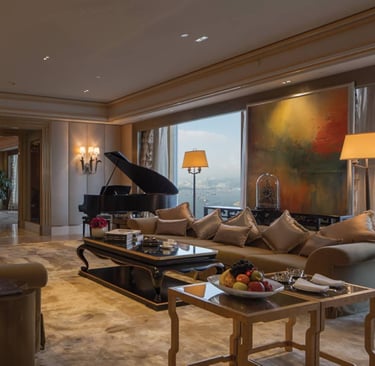 Luxury hotel suite with elegant furniture, grand piano, and city view.