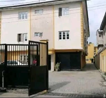 a house with a gated entrance to a house