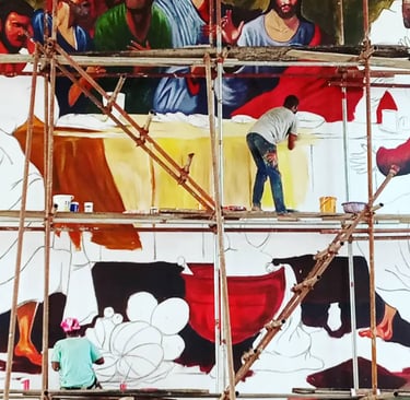 a man is painting a mural of a painting of a man 
