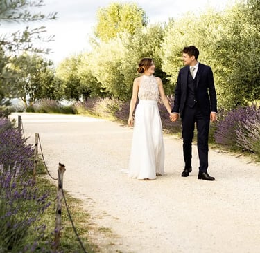 Bride and groom walking in lavender field — editorial fine art wedding photographer South of France