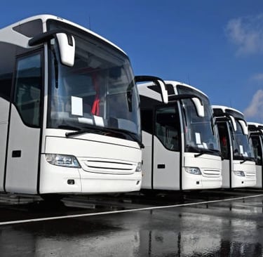 a row of buses parked in a row