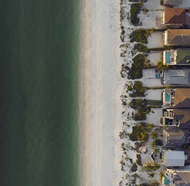 Long stretch of beach homes along the coast