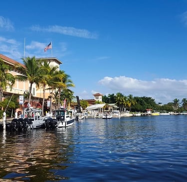 a boat docked at a dock with a boat in the water