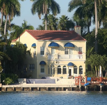a house with a boat in the water