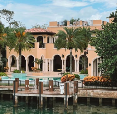 a large house with a pool and a dock