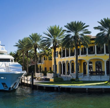 waterfront home with a yacht