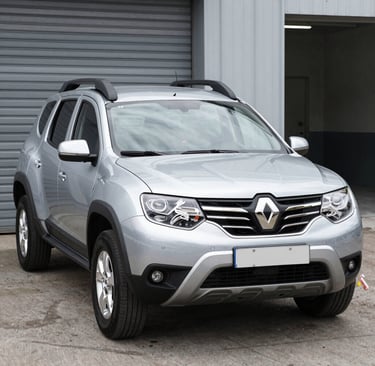 A sleek used car parked in a sunlit urban setting, showcasing its polished exterior and inviting design.