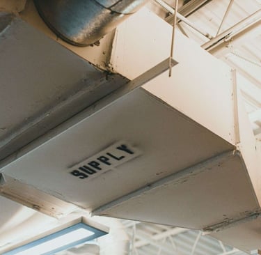 Commercial HVAC vent in a Briargate office building, a common point of hidden condensation and mold
