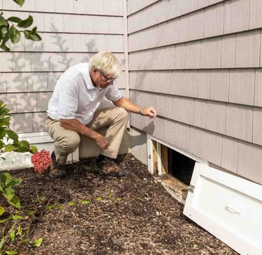Foundation vent on a historic home in Old Colorado City, a common entry point for crawl space moisture