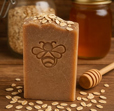 Handmade honey and oatmeal soap bar with a bee stamp on a rustic wooden table.