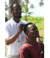 CEO braiding Daniel's hair