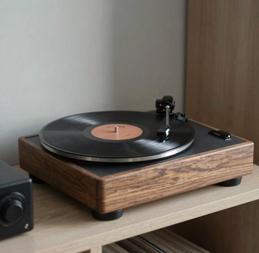 A thoughtful photography composition featuring a vintage record player and a vinyl disc on a minimal shelving unit. Soft focus on the natural grain of the wood. International / Western interior setting. Professional and curated aesthetic. Colors include Warm Grey and Dark Grey.