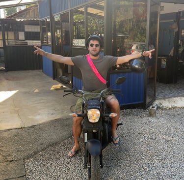 Solo traveler riding a comfortable rental scooter near Brasilito beach Costa Rica