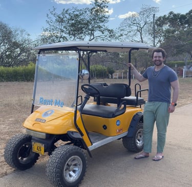 Smiling customers receiving their golf cart delivery
