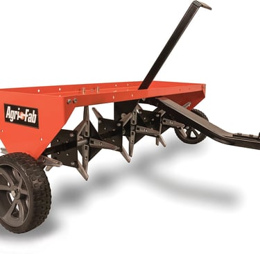 Agri-Fab tow-behind plug aerator with sharp steel tines for lawn soil aeration.