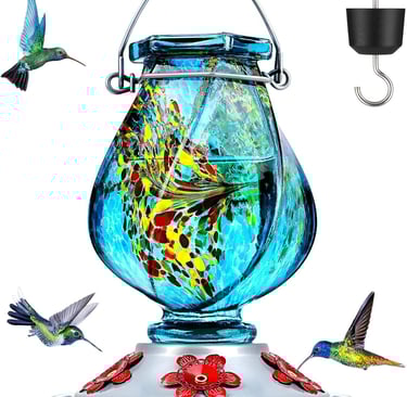Hand-blown blue glass hummingbird feeder with colorful accents and red flower feeding ports.