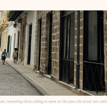 Havana city street with an outdoor cafe in the distance