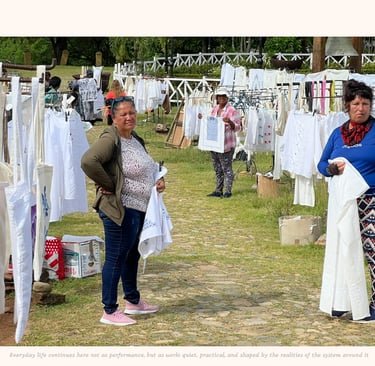 Women selling their embroidered clothing and decorations near Havana