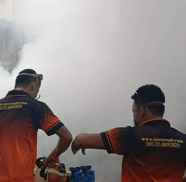 Professional pest control technicians performing thermal fogging to eliminate mosquitoes and insects.
