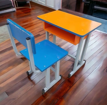 A colorful blue and orange student desk and chair set on a polished hardwood floor.