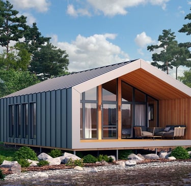 Modern prefabricated barnhouse cabin with a metal roof and glass facade on a lake shore.