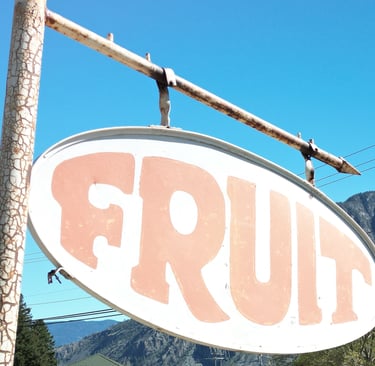 Old rusty Fruit sign identifying a road side fruit stand. The Similkameen Valley of British Columbia.