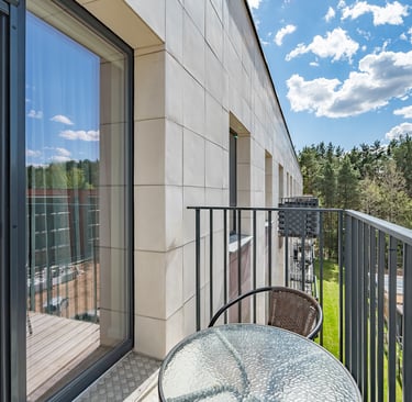 a table with a table and chairs on a balcony