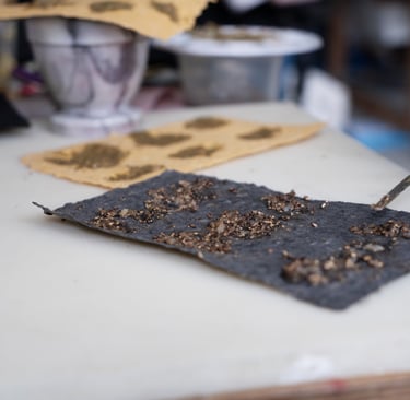 Black pepper paste on black handmade paper 