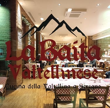 Ingresso e insegna del ristorante La Baita Valtellinese a Seregno