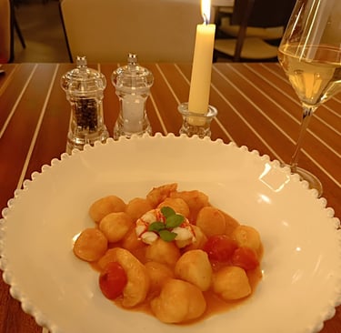 Gnocchi di pesce con pomodorini serviti al ristorante Sant’Andrea