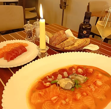 Carpaccio di salmone con ostriche e crostacei servito al ristorante Sant’Andrea