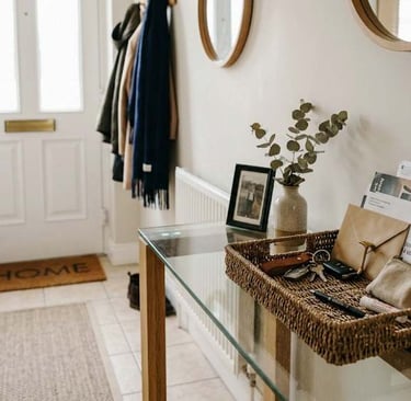 European home hallway with a small tray holding mail, keys and everyday items on a console table