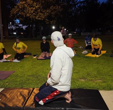 Coach Ray Z teaching a barefoot training, mobility and recovery class after Los Angeles marathon for