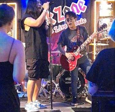 Singer and guitarist on stage at Rock Zone Bar near Soi 94, Hua Hin