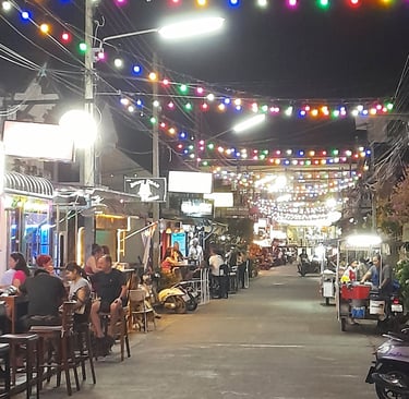 Customers sat outside bars on Soi 80, Hua Hin in Thailand