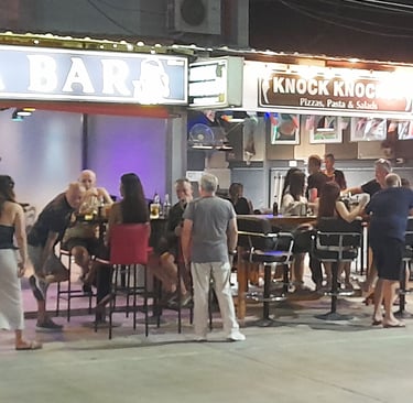 Thai women and customers outside bars on Soi 94 in Hua Hin